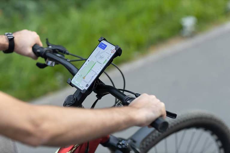 A rider using a navigation app to deliver