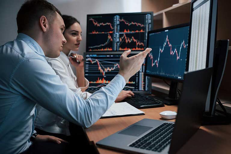 Traders looking at trades in real-time