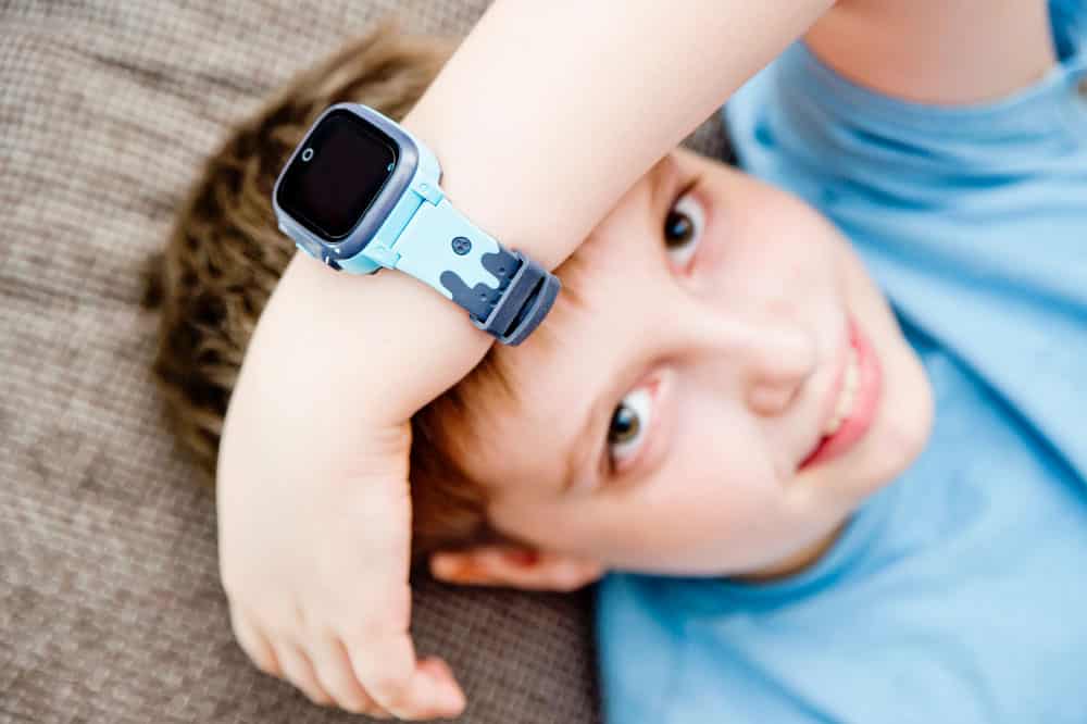 A boy wearing a children's smartwatch