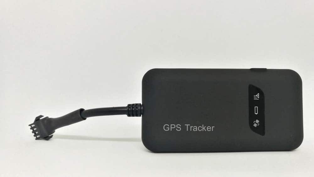 Gps Tracker Isolated On White Car